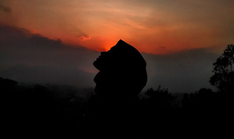 woman enjoying the sunrise in peace